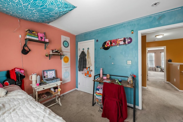 carpeted bedroom with baseboards