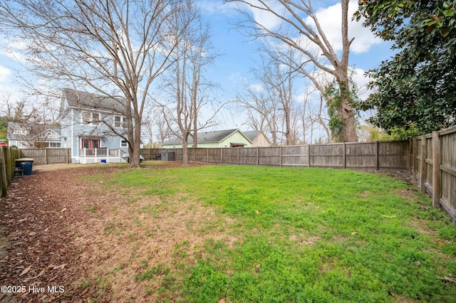 view of yard with a fenced backyard