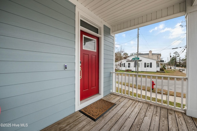 entrance to property featuring a porch