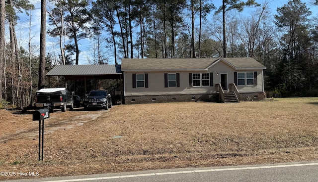 manufactured / mobile home with dirt driveway and crawl space