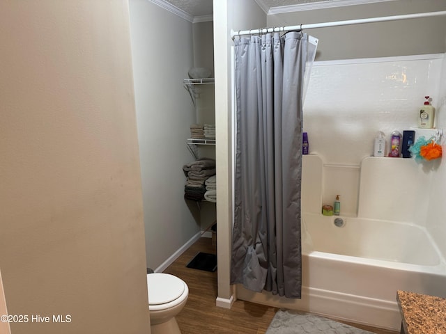 bathroom featuring toilet, wood finished floors, baseboards, shower / bath combination with curtain, and crown molding