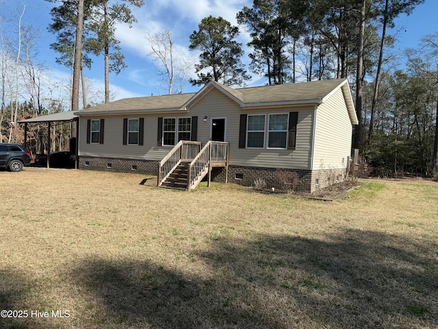 manufactured / mobile home with an attached carport, crawl space, and a front lawn