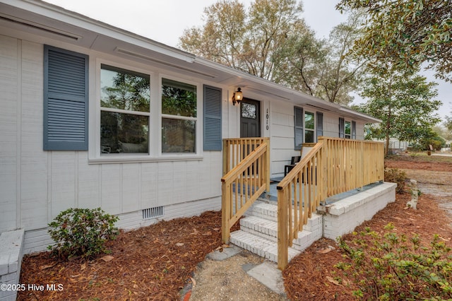 view of exterior entry featuring crawl space