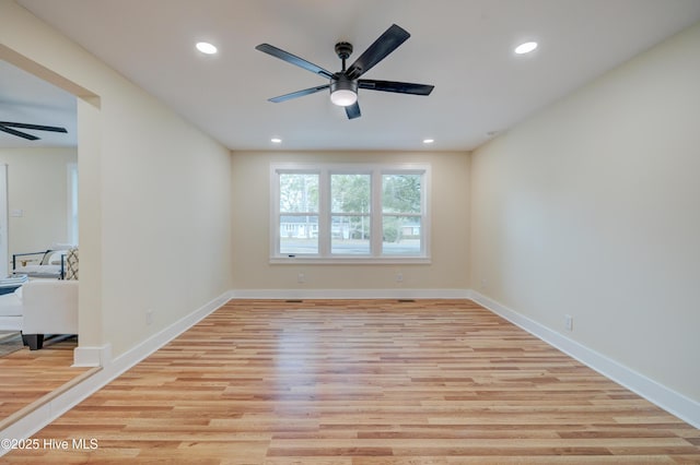 unfurnished room featuring light wood-type flooring, ceiling fan, baseboards, and recessed lighting