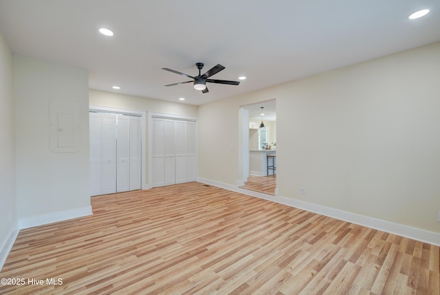 unfurnished room with a ceiling fan, recessed lighting, baseboards, and light wood finished floors