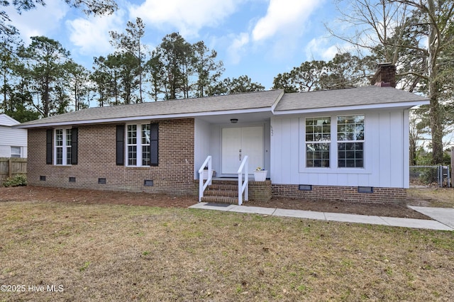 single story home with a shingled roof, a chimney, crawl space, fence, and a front yard