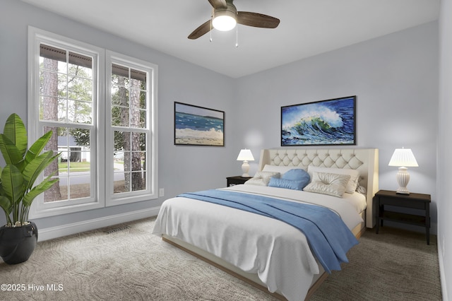 bedroom with carpet, baseboards, and a ceiling fan