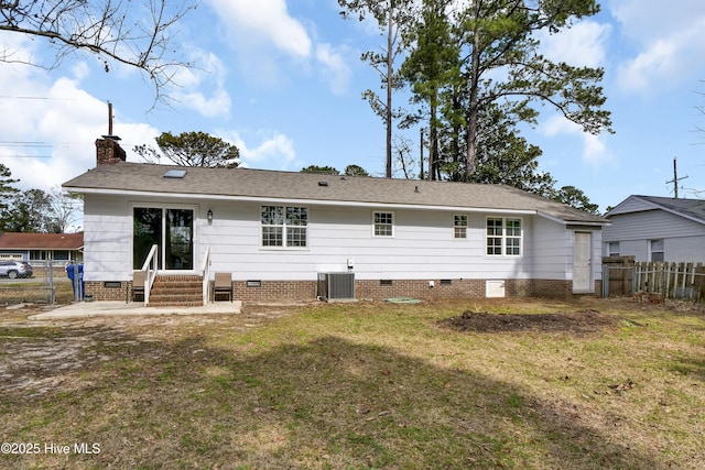 back of house featuring entry steps, crawl space, fence, and central air condition unit