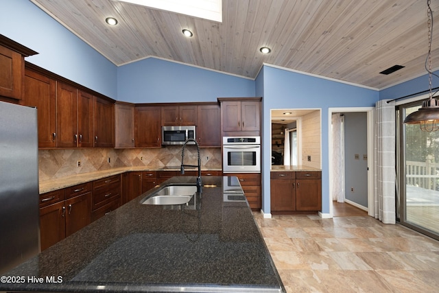 kitchen with a sink, backsplash, appliances with stainless steel finishes, and wood ceiling