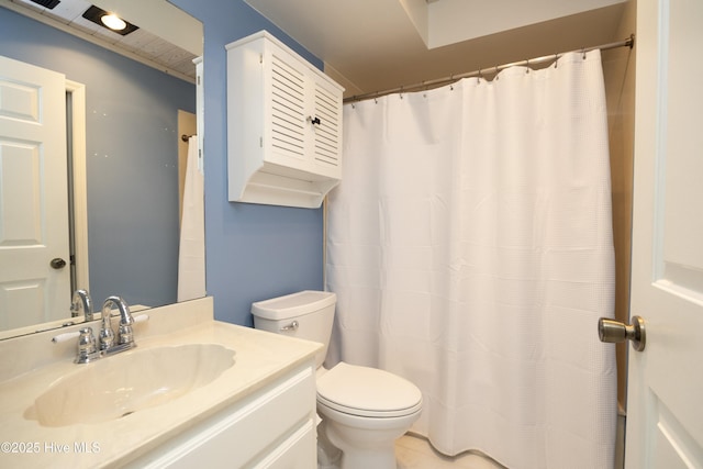 bathroom with toilet and vanity