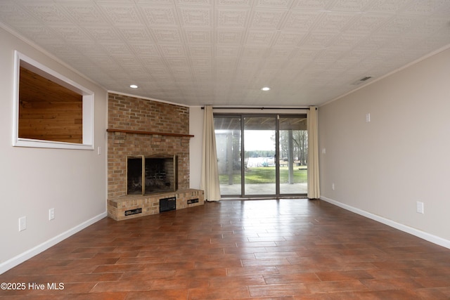 unfurnished living room featuring visible vents, a brick fireplace, baseboards, and ornamental molding