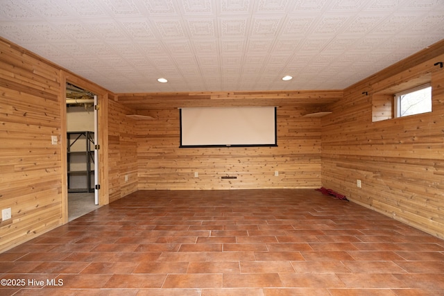 cinema room with wooden walls and recessed lighting