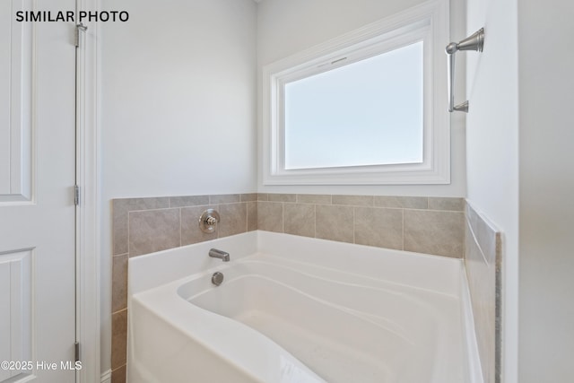 bathroom with a garden tub