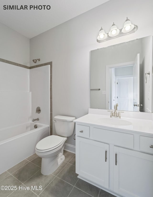 full bath featuring vanity, tile patterned floors, toilet, and  shower combination