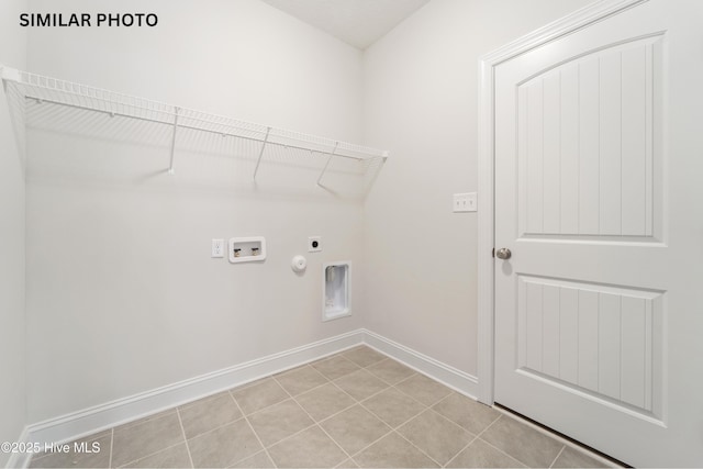 clothes washing area featuring baseboards, washer hookup, laundry area, hookup for a gas dryer, and electric dryer hookup