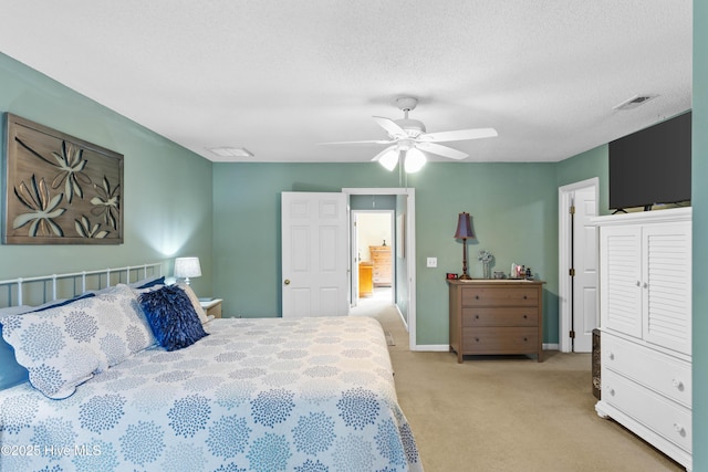 bedroom featuring a ceiling fan, visible vents, baseboards, a textured ceiling, and light colored carpet