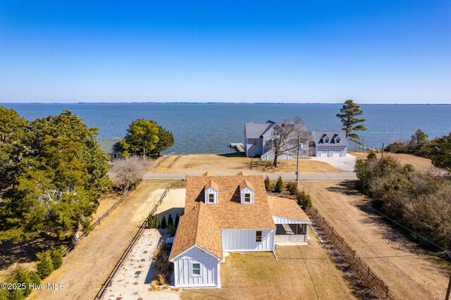 view of front of house featuring roof with shingles and board and batten siding