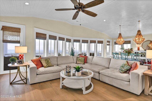 living room with ceiling fan, recessed lighting, vaulted ceiling, and hardwood / wood-style flooring