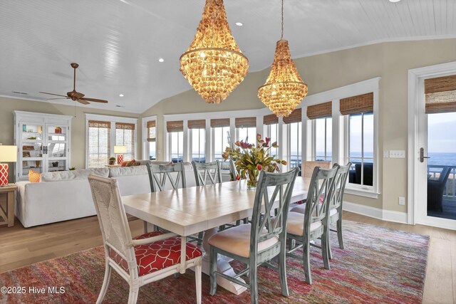 dining space with vaulted ceiling, baseboards, wood finished floors, and recessed lighting