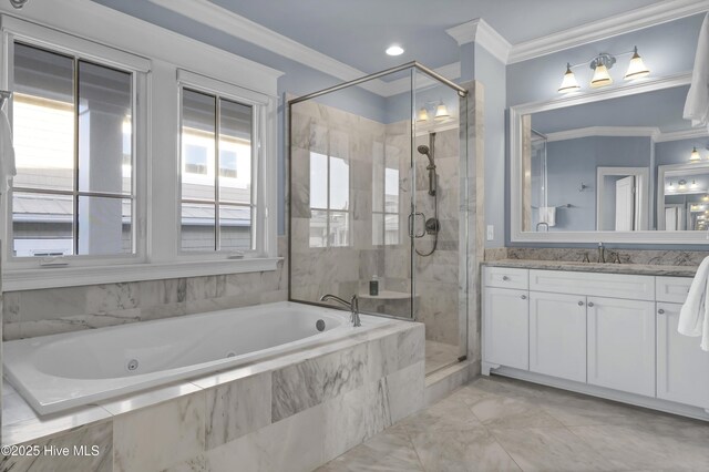 bathroom featuring crown molding, a shower stall, a tub with jets, and vanity