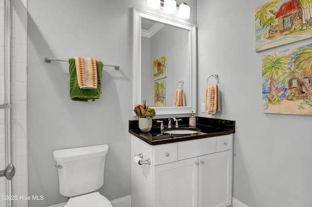 full bathroom featuring baseboards, vanity, and toilet