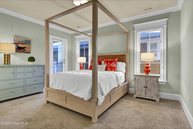 bedroom featuring light carpet, baseboards, visible vents, and crown molding