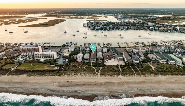 aerial view at dusk with a water view