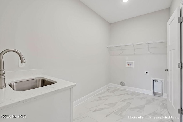 washroom with hookup for a washing machine, laundry area, a sink, baseboards, and marble finish floor