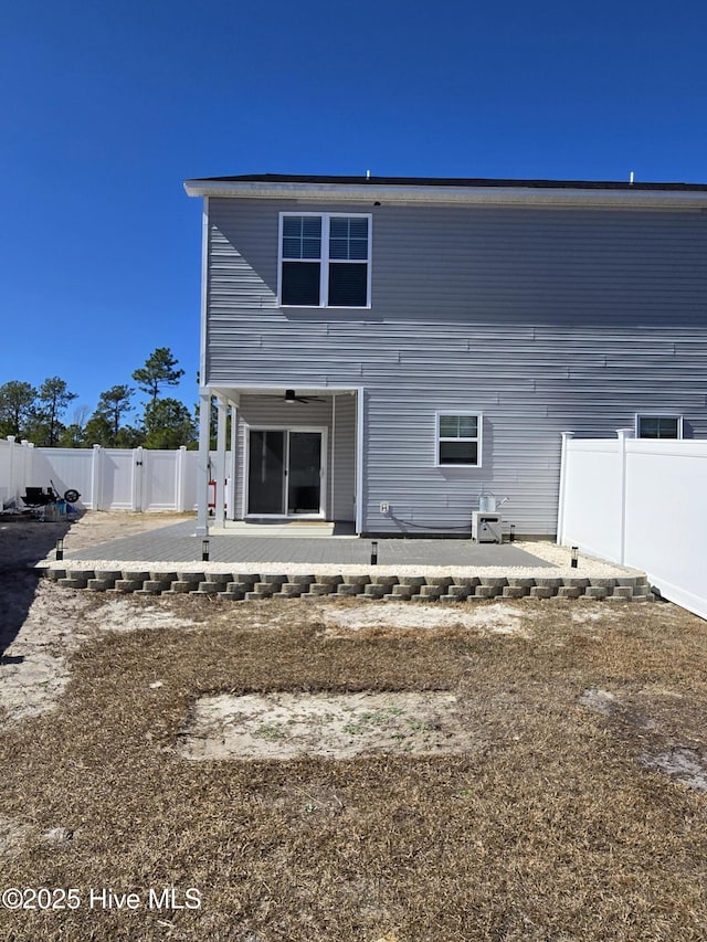 back of house with a patio, a gate, a fenced backyard, and a ceiling fan