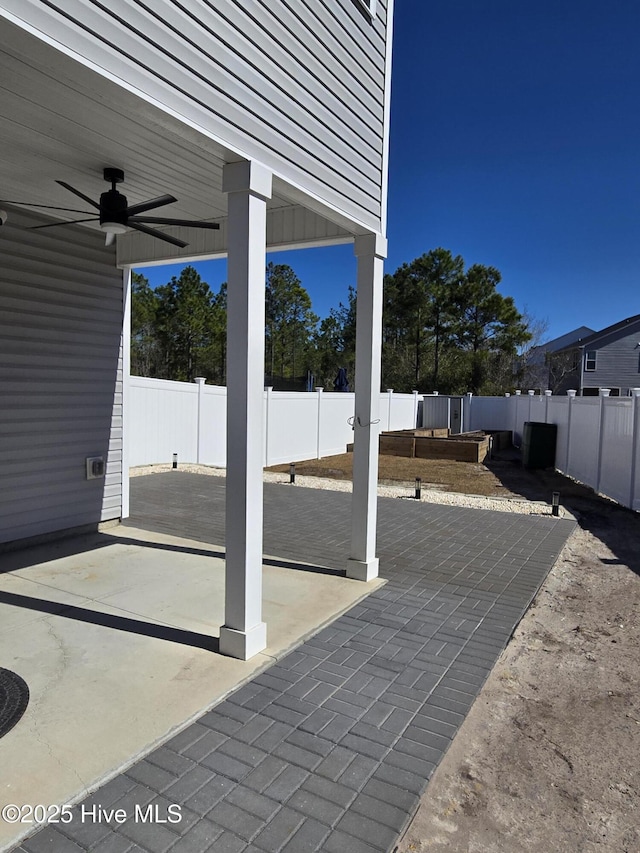 view of patio with a ceiling fan and a fenced backyard