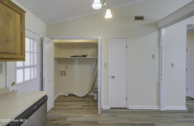 laundry room with laundry area, dark wood-style flooring, washer hookup, visible vents, and baseboards