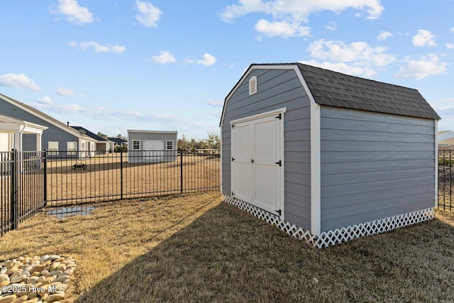 view of shed with a fenced backyard