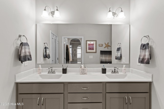 bathroom featuring double vanity and a sink