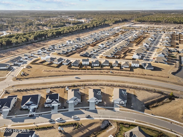 birds eye view of property with a residential view