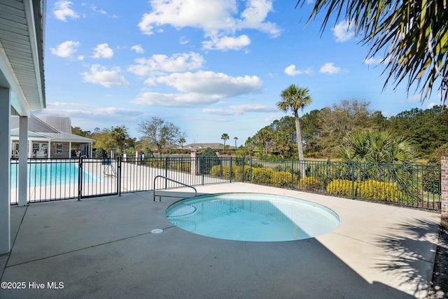 view of pool featuring a fenced in pool, fence, and a patio area