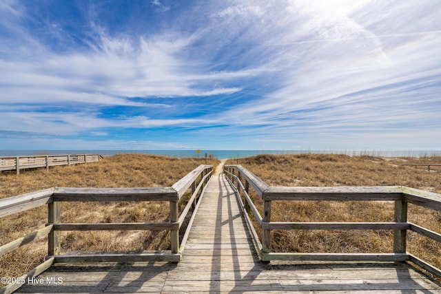 surrounding community featuring a water view