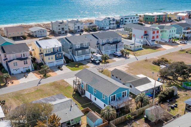 drone / aerial view with a water view and a residential view