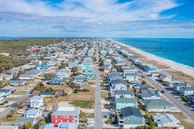 bird's eye view with a beach view, a residential view, and a water view