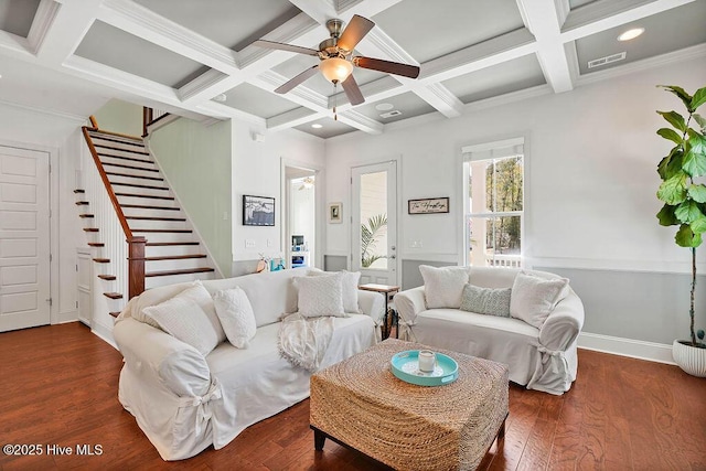 living room featuring visible vents, wood finished floors, beamed ceiling, baseboards, and stairs