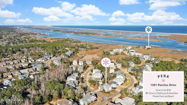 birds eye view of property featuring a water view and a residential view