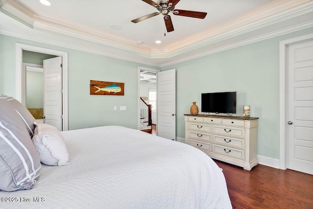 bedroom with crown molding, dark wood finished floors, baseboards, and a ceiling fan