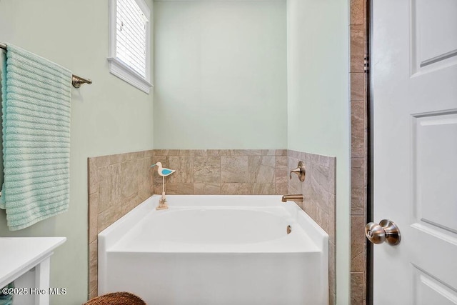 bathroom with a garden tub