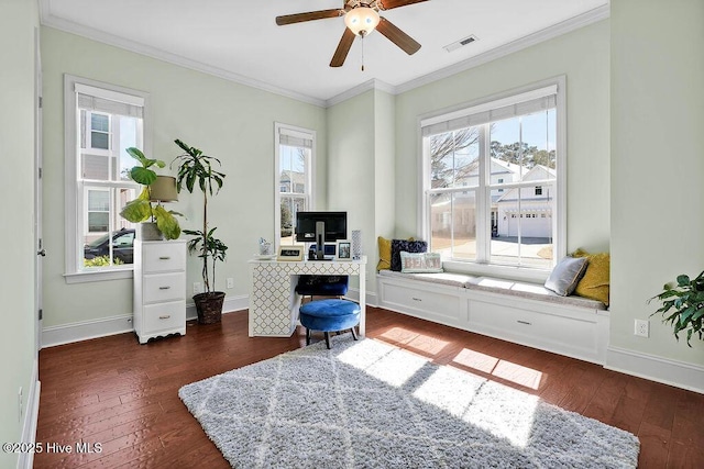 office area with hardwood / wood-style flooring, a ceiling fan, visible vents, baseboards, and ornamental molding