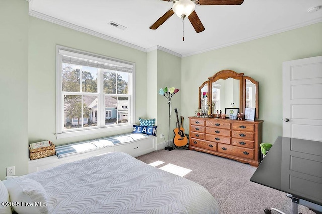 bedroom with ceiling fan, carpet floors, visible vents, baseboards, and crown molding