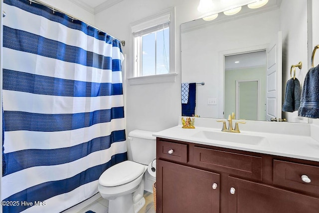 full bathroom featuring curtained shower, vanity, toilet, and crown molding