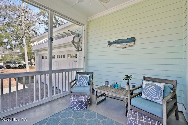 sunroom / solarium with a ceiling fan