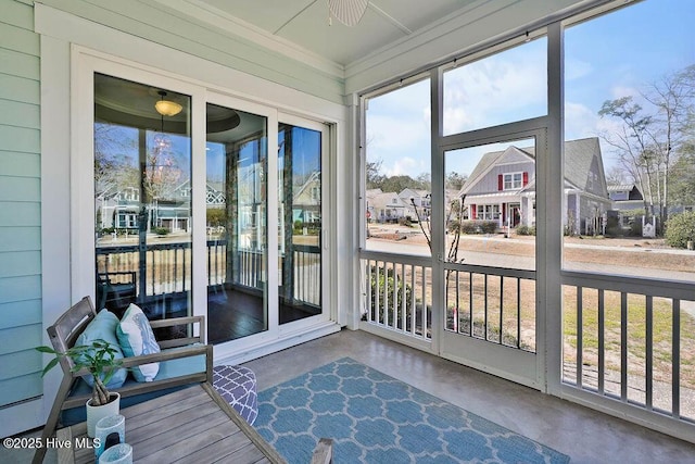 sunroom / solarium with a residential view