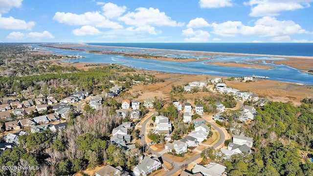 drone / aerial view with a residential view and a water view