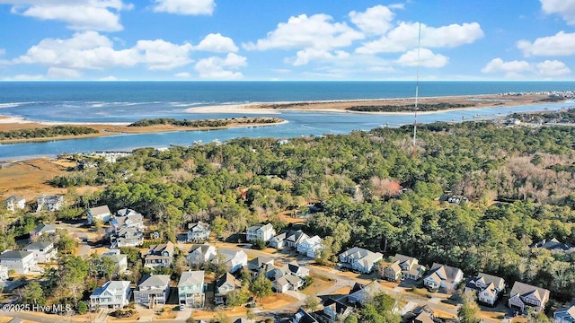 birds eye view of property with a water view and a residential view