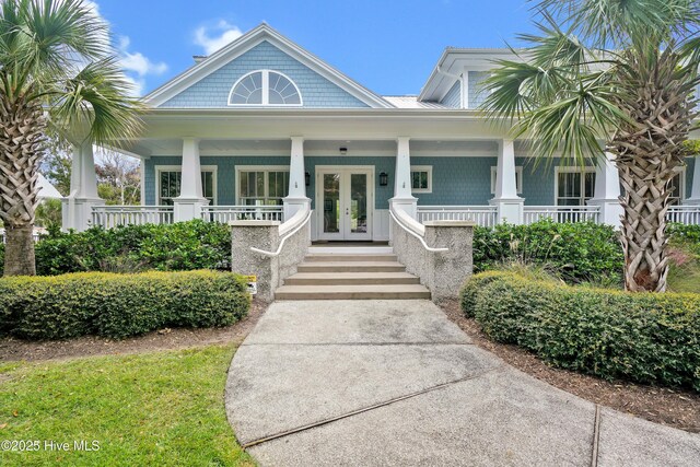 wooden terrace featuring covered porch